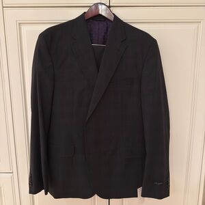 Elegant dark gray/black with blue stripe suit by Ted Baker.